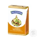 Сир плавлений Наш Молочник Грінки з часником скибковий 40% 90г