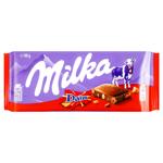 Шоколад молочний Milka зі шматочками хрумкої карамелі з мигдалем 90г