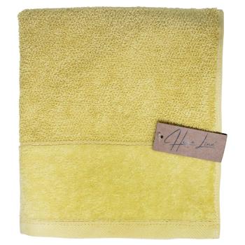 Рушник махр. HomeLine Валенсія 40х70 см Жовтий 177648 - купить, цены на КОСМОС - фото 1