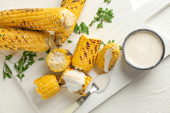 Corn under cheese sauce